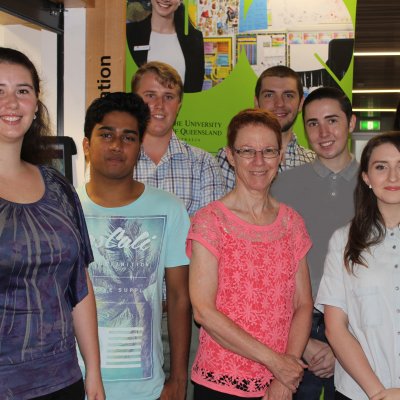 Head of School of Education Professor Merrilyn Goos with (left to right) students Emily Muller, Vishael Narayan, Jordan Duncombe, Eamonn O’Loughlin, Jarrod Golltz, Tessa Hogan and Chelsea Iddon